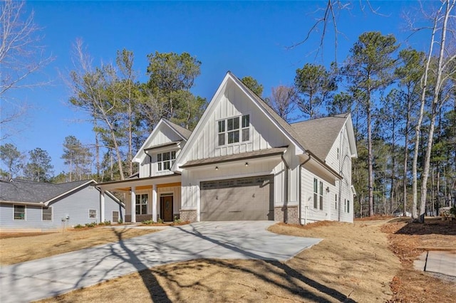 modern farmhouse style home featuring a garage and a porch