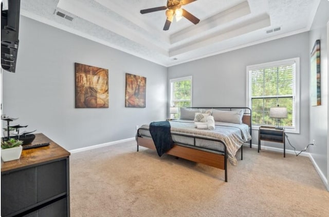 bedroom featuring multiple windows, carpet floors, ceiling fan, and crown molding