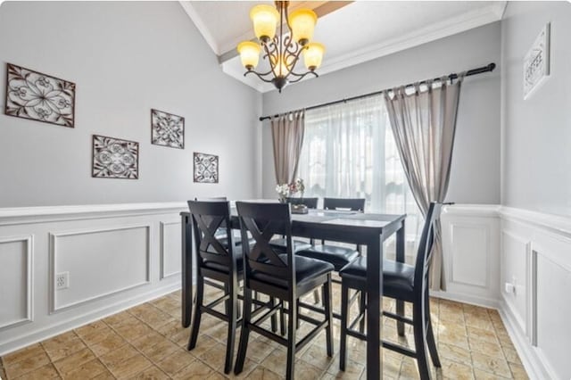 dining room featuring an inviting chandelier, vaulted ceiling, and ornamental molding