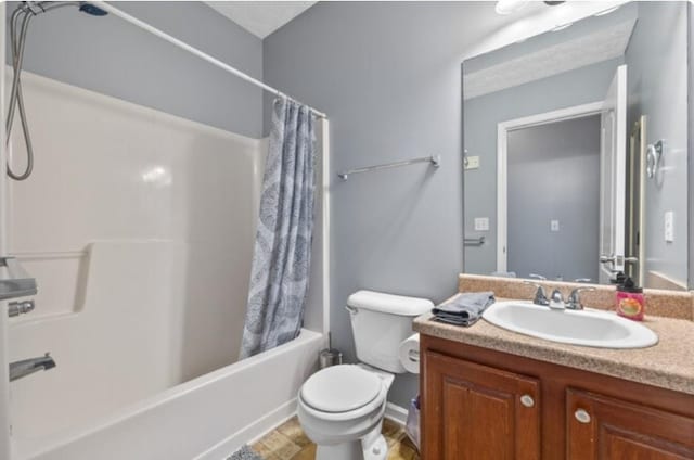 full bathroom featuring shower / bath combination with curtain, vanity, and toilet