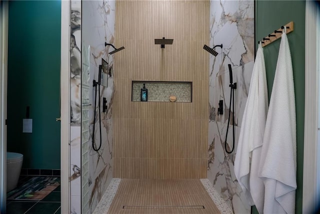 bathroom featuring toilet and walk in shower