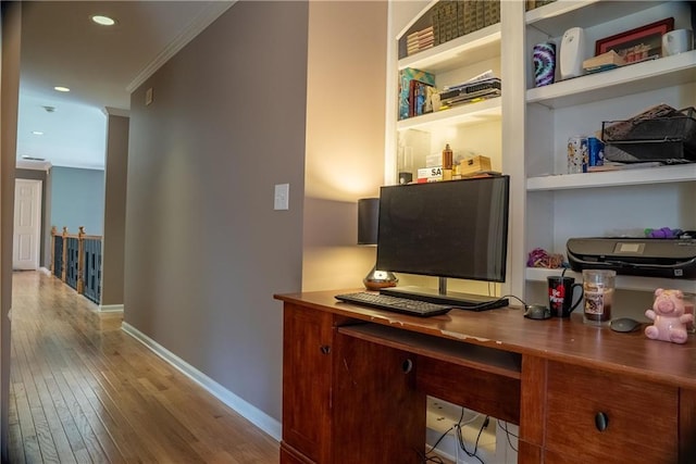 office space featuring crown molding, baseboards, recessed lighting, and hardwood / wood-style floors