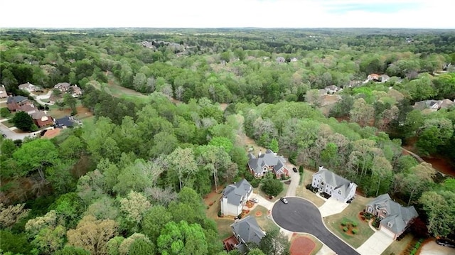 drone / aerial view with a view of trees and a residential view