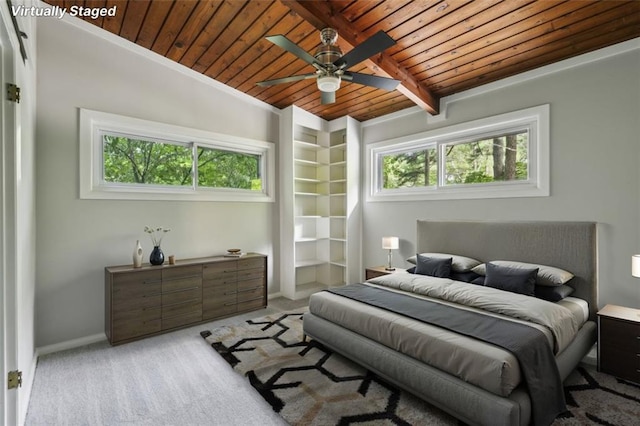 bedroom with wooden ceiling, light colored carpet, baseboards, and a ceiling fan