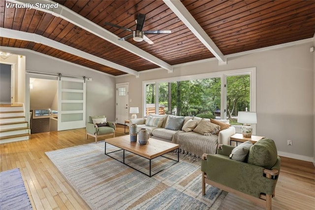 living room featuring a barn door, plenty of natural light, stairs, wood-type flooring, and wooden ceiling