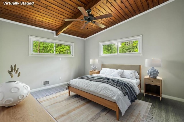 bedroom featuring wood ceiling, baseboards, crown molding, and ceiling fan