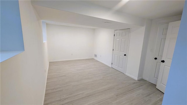 basement with light wood-type flooring