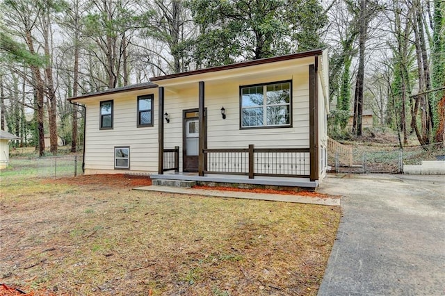 raised ranch featuring a front lawn