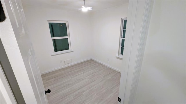 unfurnished room with light hardwood / wood-style floors