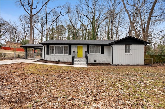 view of front facade with a carport