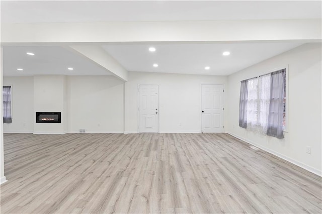 unfurnished living room featuring light hardwood / wood-style flooring