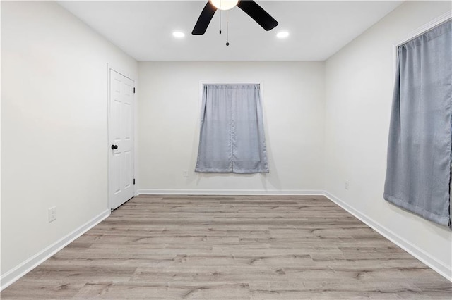 empty room with light hardwood / wood-style floors and ceiling fan