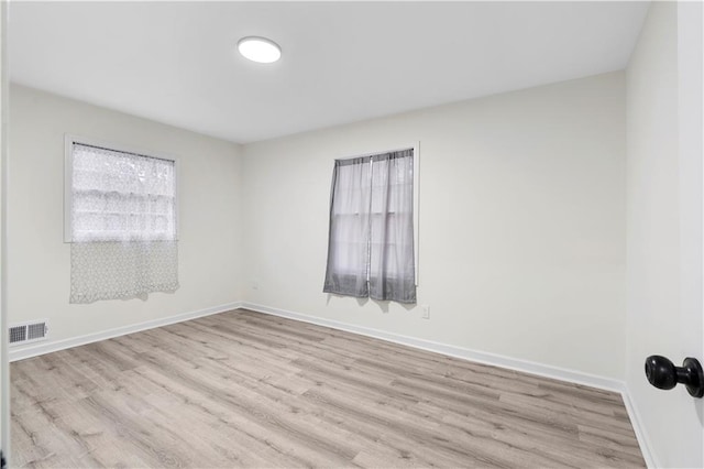 empty room featuring light hardwood / wood-style floors