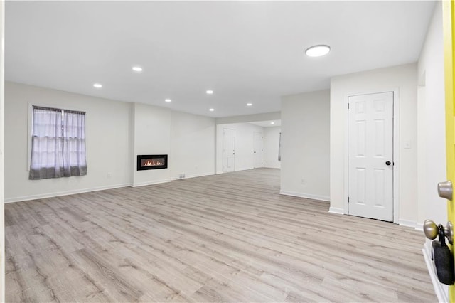 unfurnished living room featuring light wood-type flooring