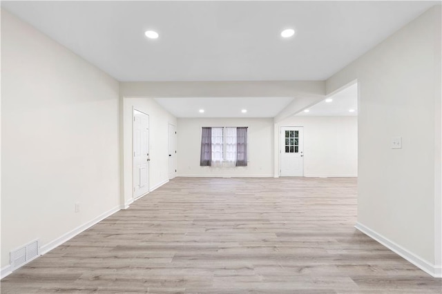 spare room featuring light wood-type flooring