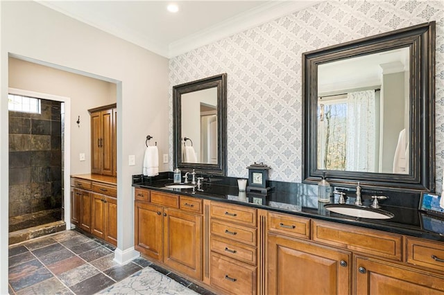 full bathroom with ornamental molding, stone tile flooring, a sink, and wallpapered walls