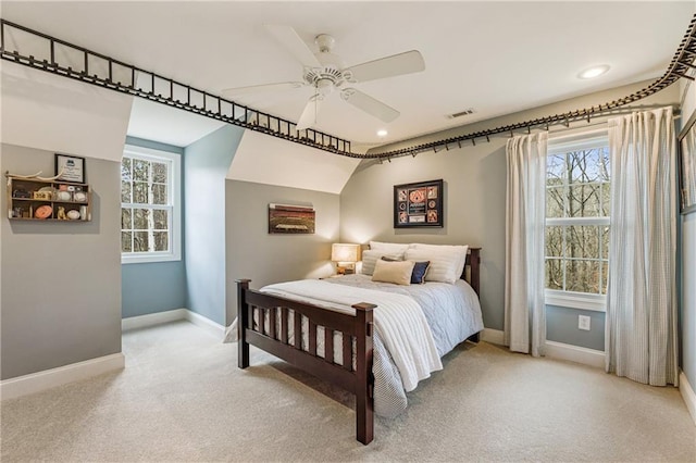 bedroom featuring light carpet, a ceiling fan, visible vents, and baseboards