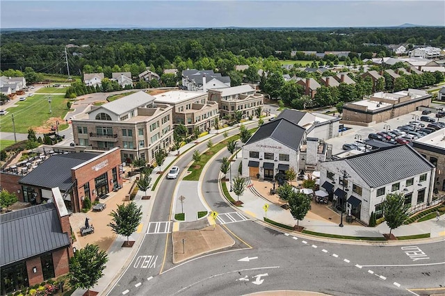 aerial view featuring a residential view and a wooded view