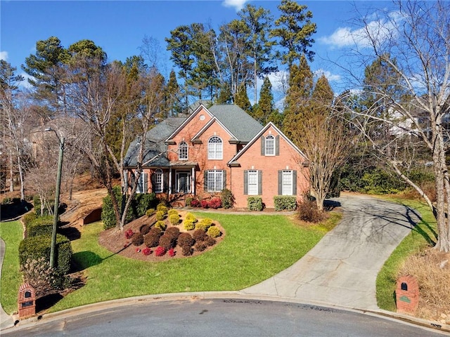 view of property featuring a front lawn