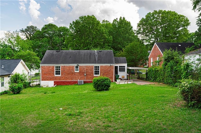 2656 Northview Ave, Decatur, GA 30032 - rear view of property featuring a patio area, a carport, brick siding, central AC, and a yard