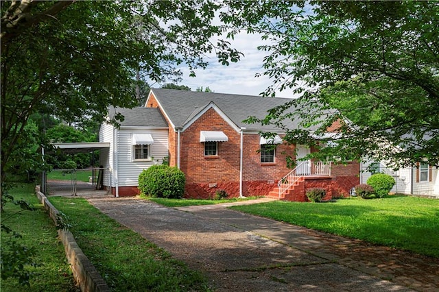 2656 Northview Ave, Decatur, GA 30032 - bungalow-style home with a front yard, brick siding, fence, aphalt driveway, and an attached carport