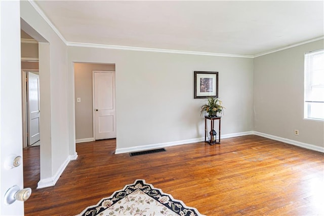2656 Northview Ave, Decatur, GA 30032 - spare room featuring baseboards, visible vents, ornamental molding, and wood finished floors