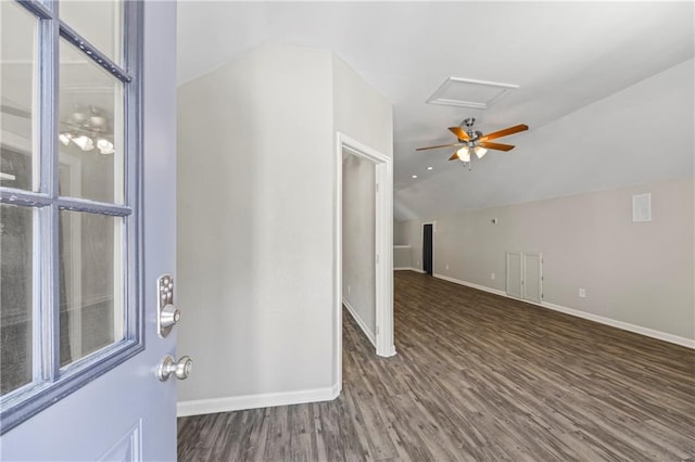 entrance foyer featuring baseboards, wood finished floors, and lofted ceiling