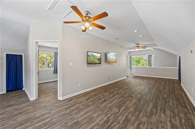 additional living space featuring ceiling fan, wood finished floors, vaulted ceiling, and a wealth of natural light
