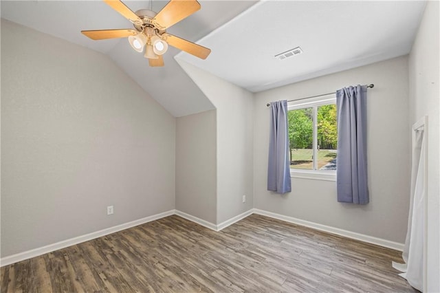 bonus room with baseboards, a ceiling fan, vaulted ceiling, and wood finished floors