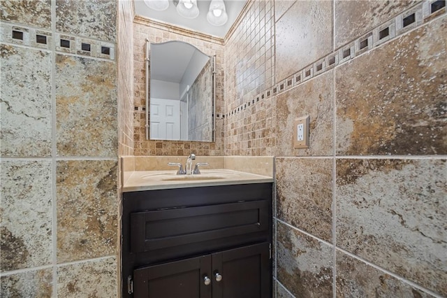 bathroom featuring tile walls and vanity