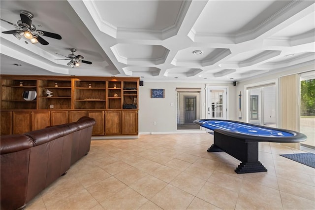 game room featuring a ceiling fan, light tile patterned floors, baseboards, ornamental molding, and coffered ceiling