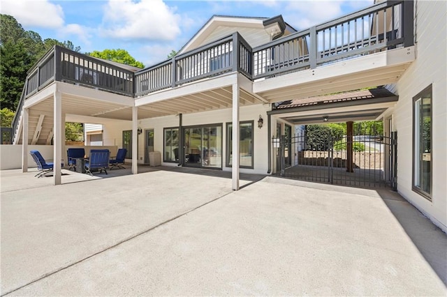 view of patio / terrace with fence and a balcony