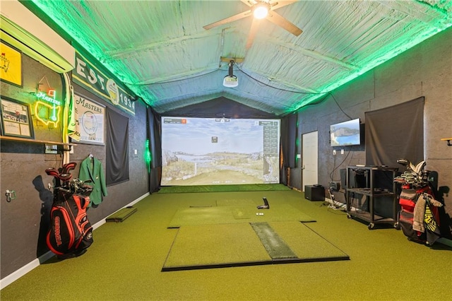 rec room with carpet floors, a ceiling fan, golf simulator, and vaulted ceiling