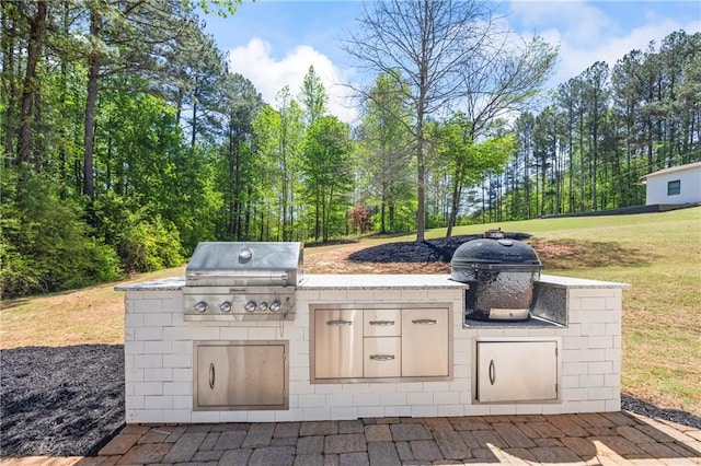 view of patio featuring exterior kitchen and grilling area