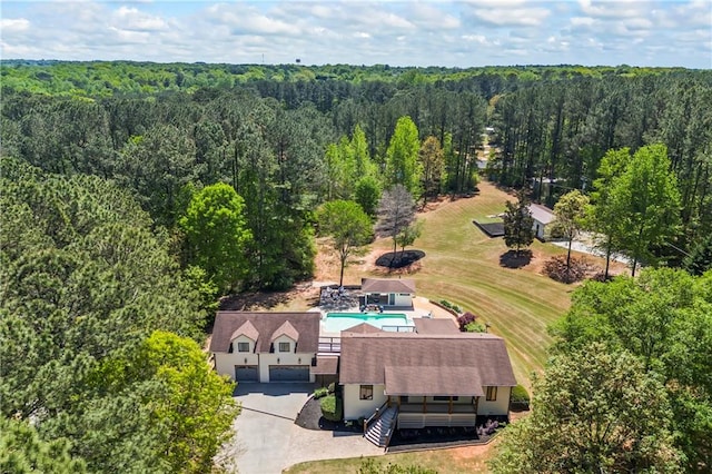 drone / aerial view featuring a view of trees