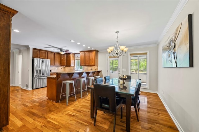 dining space featuring recessed lighting, baseboards, a notable chandelier, and ornamental molding