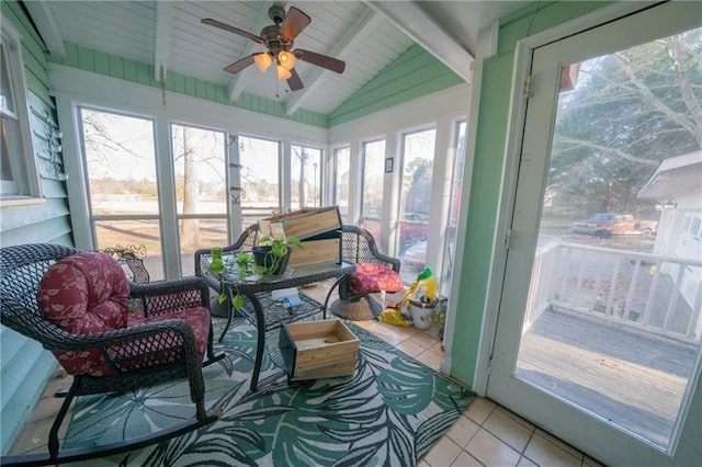 sunroom / solarium with vaulted ceiling with beams, ceiling fan, and wooden ceiling