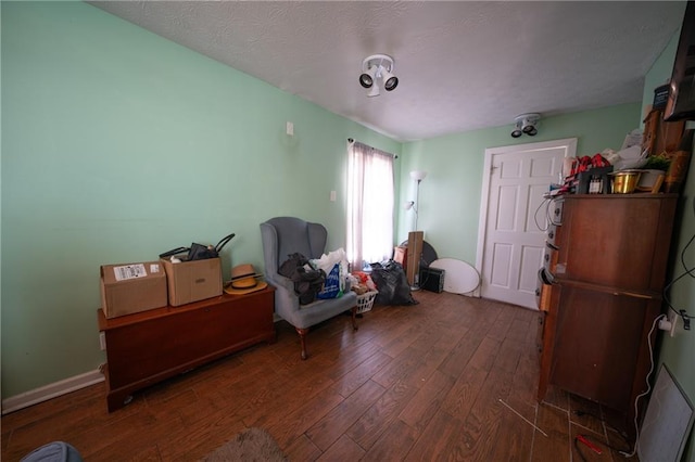 sitting room featuring dark hardwood / wood-style floors