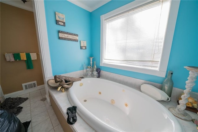 bathroom featuring crown molding, a washtub, and tile patterned flooring