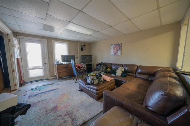 living room featuring a paneled ceiling