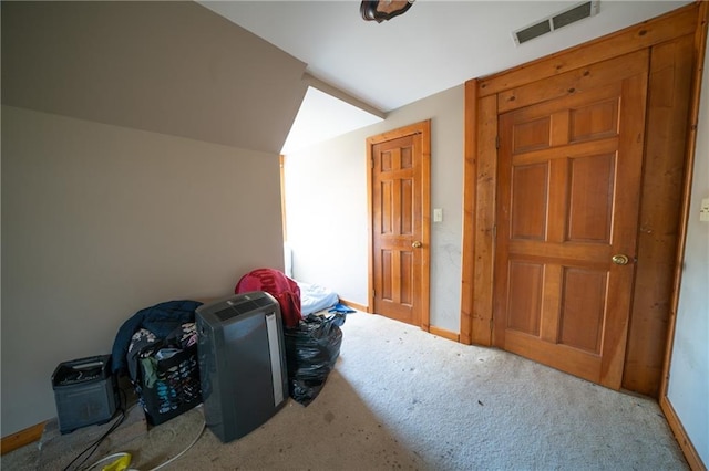 additional living space with light carpet and lofted ceiling