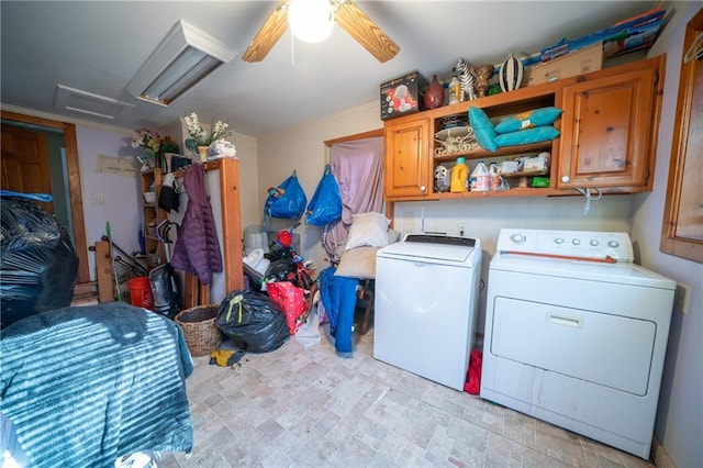 laundry room featuring cabinets, separate washer and dryer, and ceiling fan