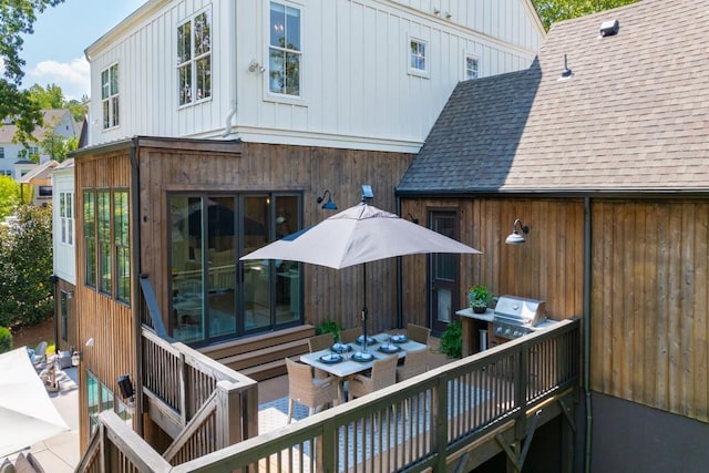 rear view of property featuring board and batten siding, outdoor dining space, roof with shingles, and an outdoor hangout area