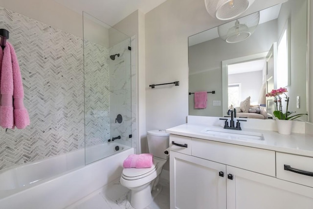 bathroom featuring vanity, toilet, and  shower combination