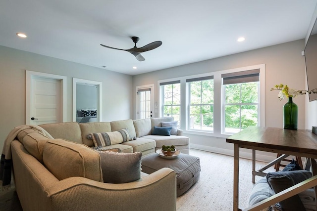 living area featuring baseboards, a ceiling fan, and recessed lighting