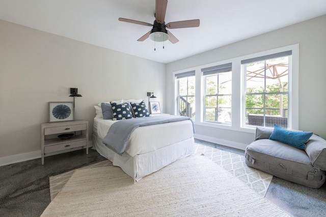 bedroom with baseboards and ceiling fan