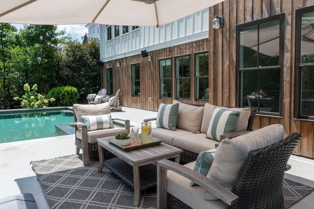 view of patio / terrace with an outdoor hangout area and an outdoor pool