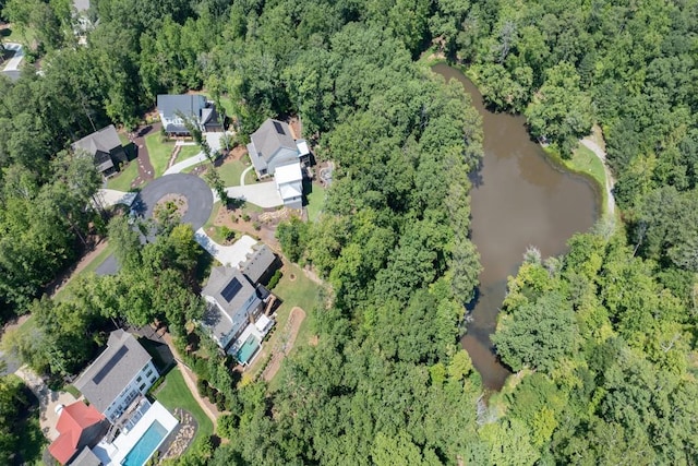 bird's eye view featuring a water view and a forest view