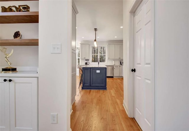 hall with light wood-type flooring