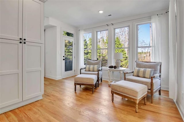 living area with light hardwood / wood-style floors